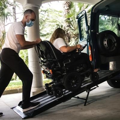 Vehicle Lift to Push Mobility Scooter into Van. 